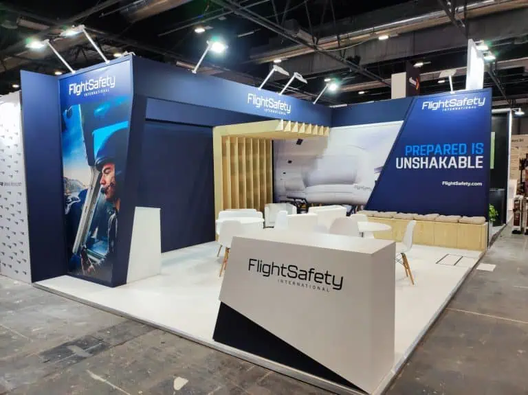 A professional exhibition booth designed and constructed by ADAM EXPO STAND at IFEMA Madrid, featuring modern design elements, vibrant branding, and interactive displays that attract trade show attendees.
