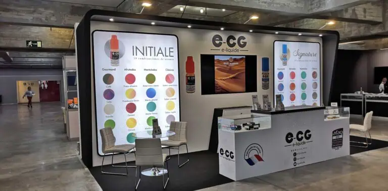 e-CG French brand exhibition stand with giant backlit product panels and glass display counters at industry expo in Spain