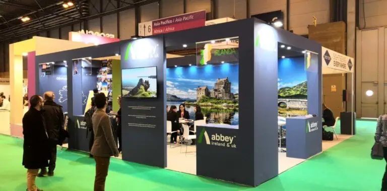 Abbey Ireland and UK tourism exhibition stand with Irish castle landscape graphics at FITUR travel fair IFEMA Madrid